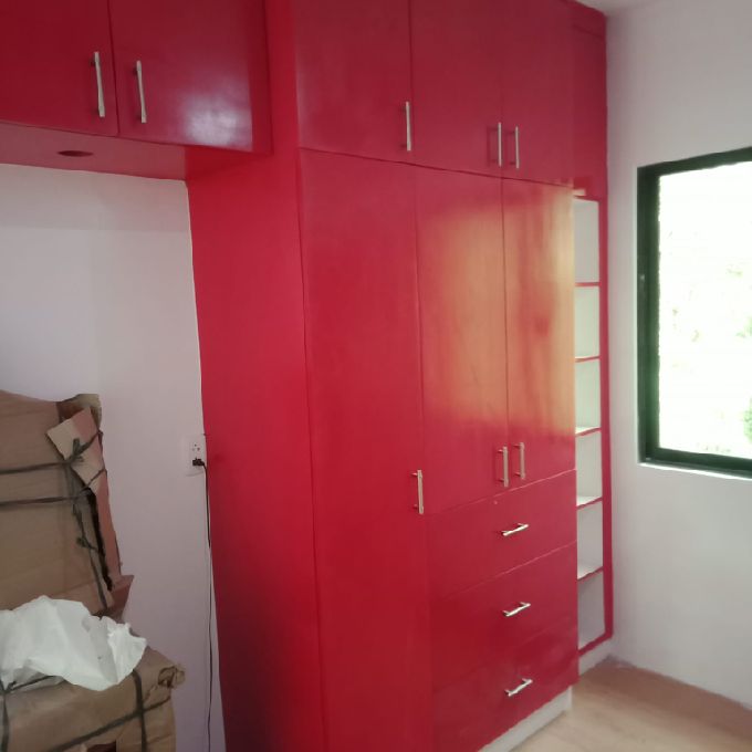 Installation of Red Laminated MDF Wardrobe in Mwembe Tayari
