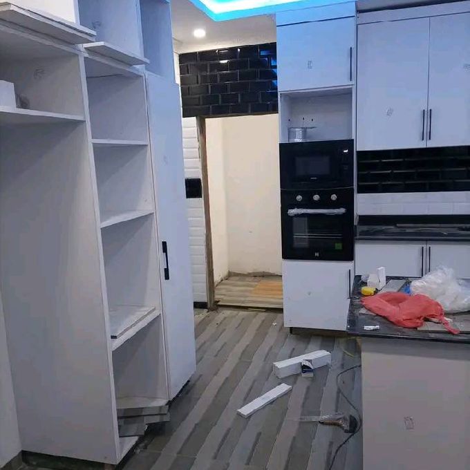 Setting Up White MDF Kitchen Cabinet Shelves in Kabati