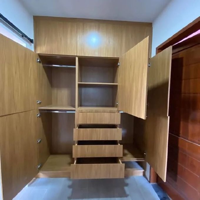 Light Walnut MDF Wardrobe Closet Installation for a House in Umoja