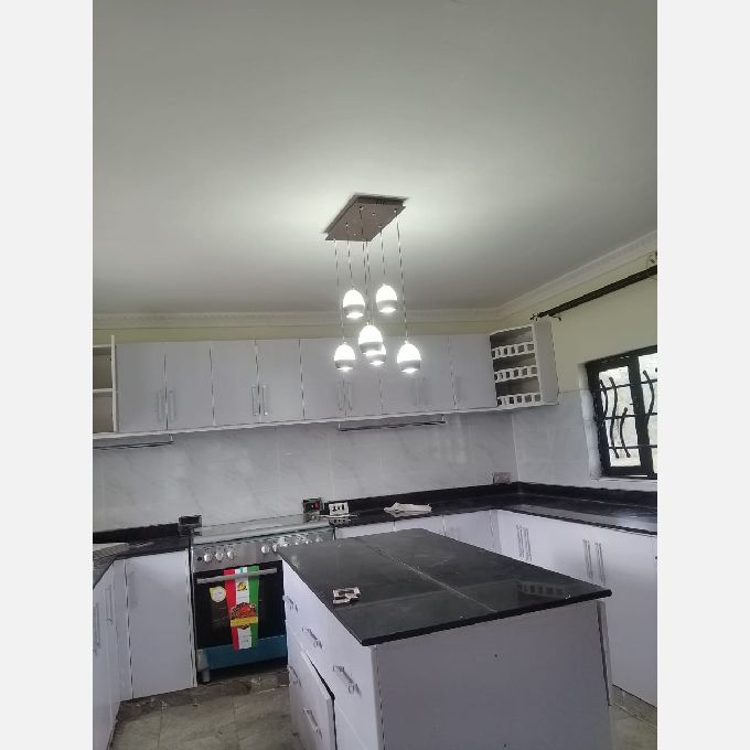 Installation of White Laminated MDF Kitchen Cabinets in Molo